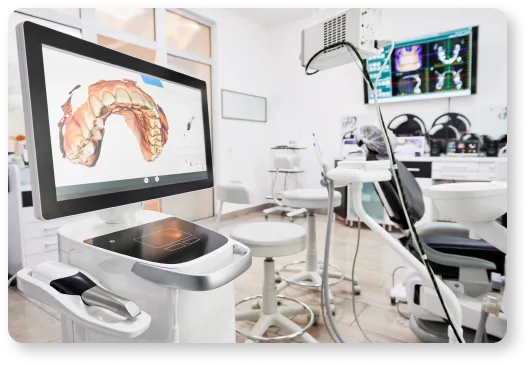 a medical room with a monitor and chairs